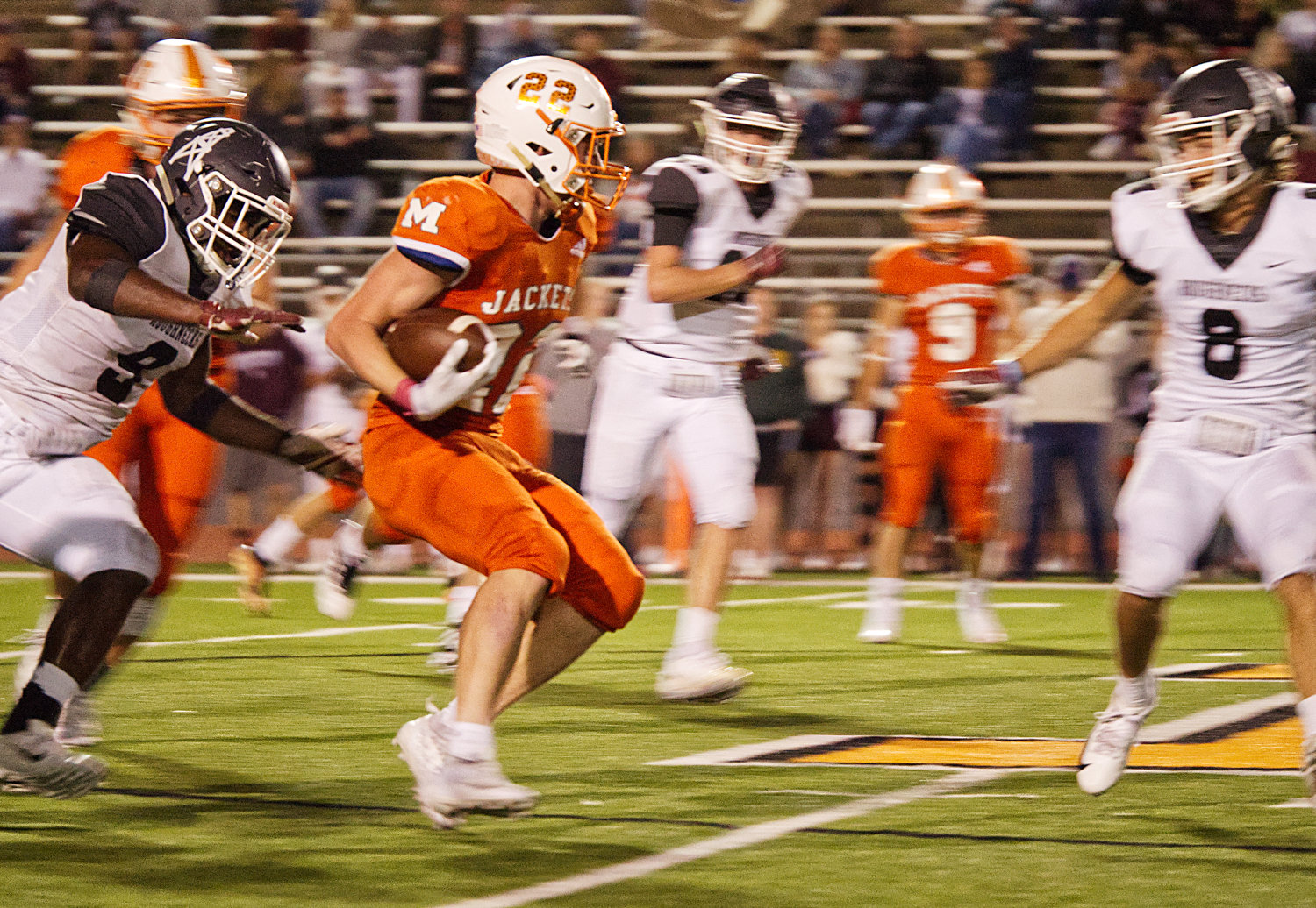 Dawson Pendergrass (22) weaves through the Roughneck defense, adding to his more than 200 yards rushing on Friday night.